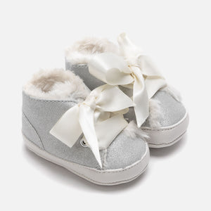 Treat little ones to their first pair of booties with these sweet silver shoes Spanish fashion brand, Mayoral. Crafted from a soft fabric, they're finished with a satin bow and would look adorable paired with any outfit.
